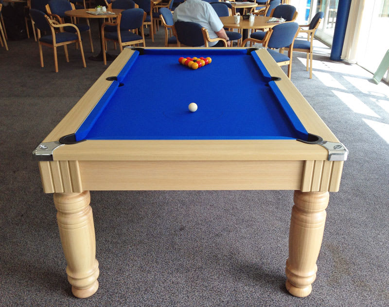 Optima Oxford Pool Dining Table in Oak with a Blue Cloth