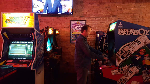 headquarters-2-barcade-andy-playing-paperboy-arcade-machine.jpg