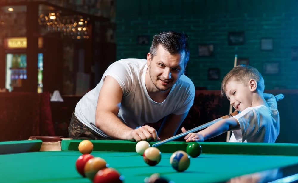 father-and-son-playing-billiards.jpeg