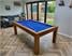 signature-chester-pool-dining-table-oak-finish-blue-cloth-installation.jpeg