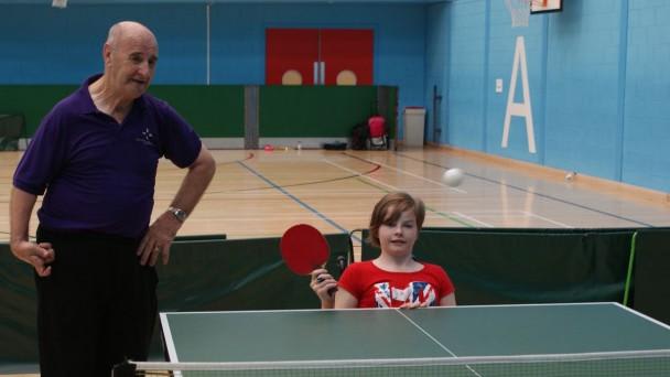 Children learning to play Table Tennis