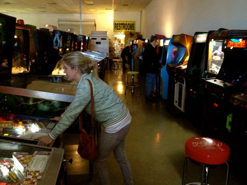 Michelle Playing Pinball at Pinball Hall of Fame